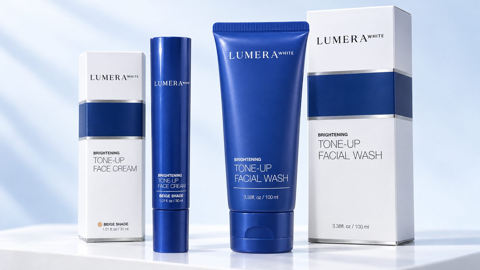 Lumera White Tone-Up Face Cream in Beige shade and Tone-Up Facial Wash, each shown with its white and navy carton
